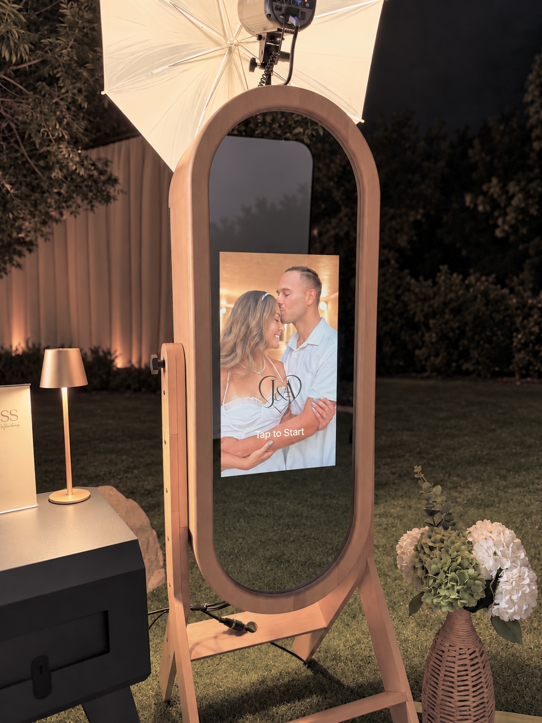 Our full-length interactive mirror photobooth with a personalized touchscreen and studio lighting.
