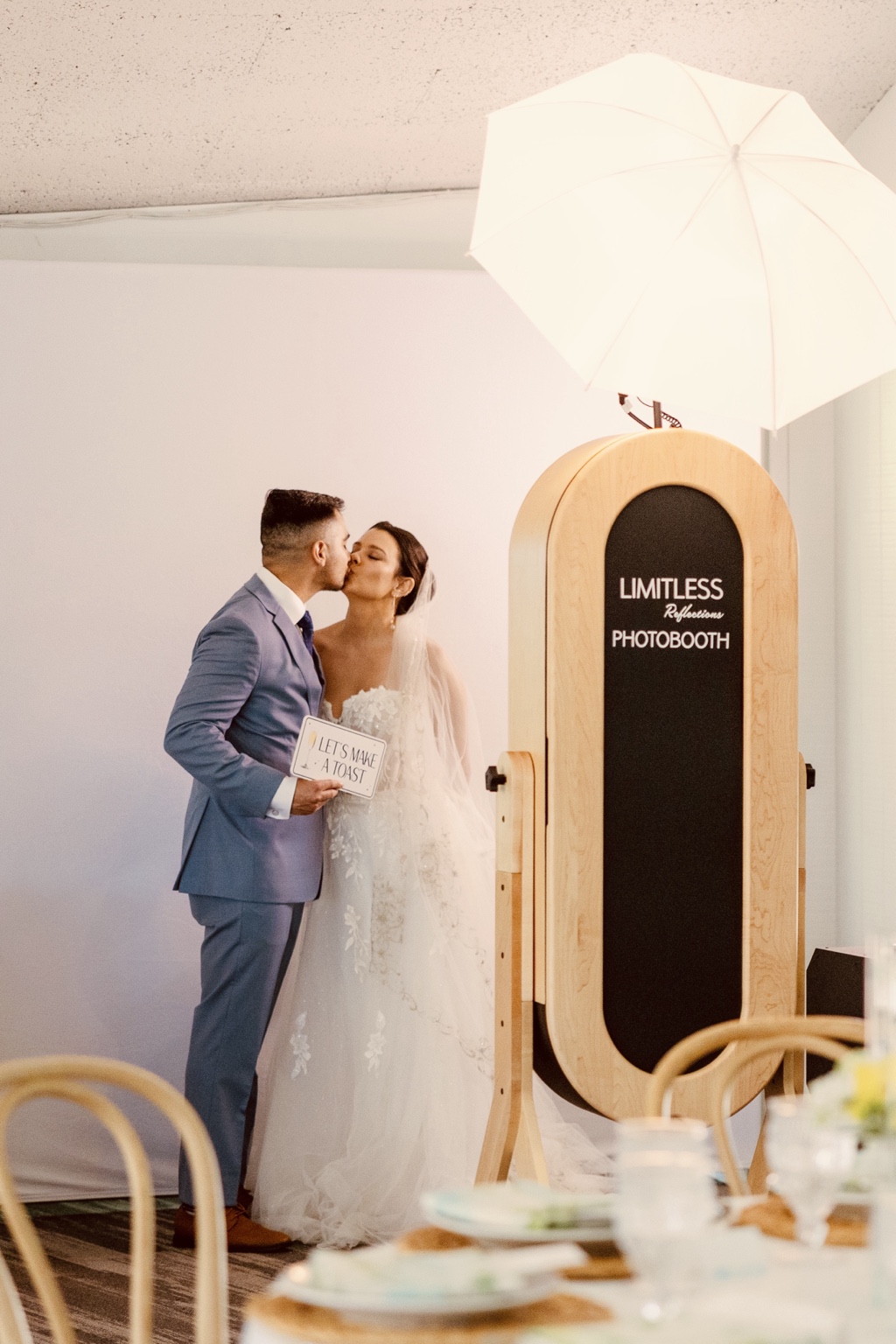 Bride and groom beside the photobooth